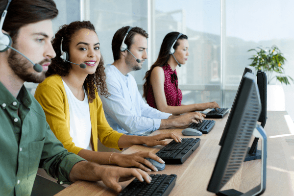 A customer support representative using a fixed VoIP phone number for seamless communication.