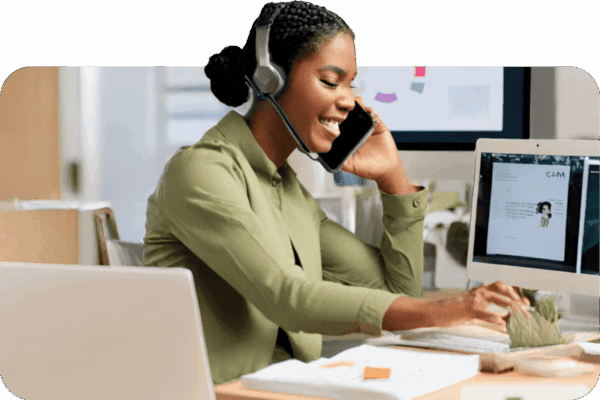 Businesswoman talking on a Vonix desk phone in an office setting