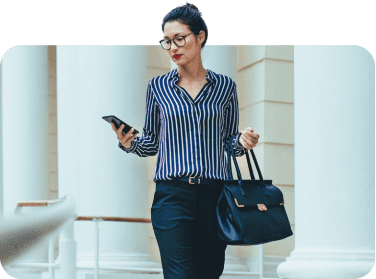 Woman using the Vonix mobile app on her phone to stay connected with her team